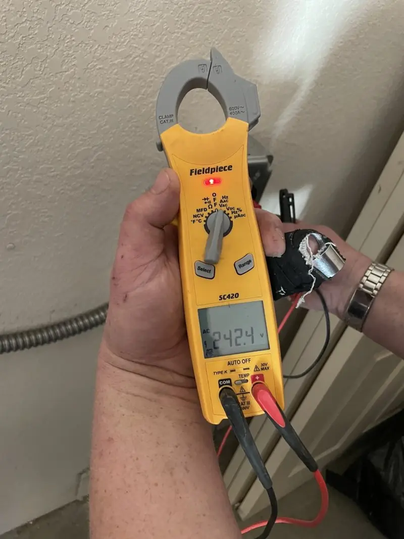 Voltage testing with clamp meter during Ceiling Fan Installation in Garnet